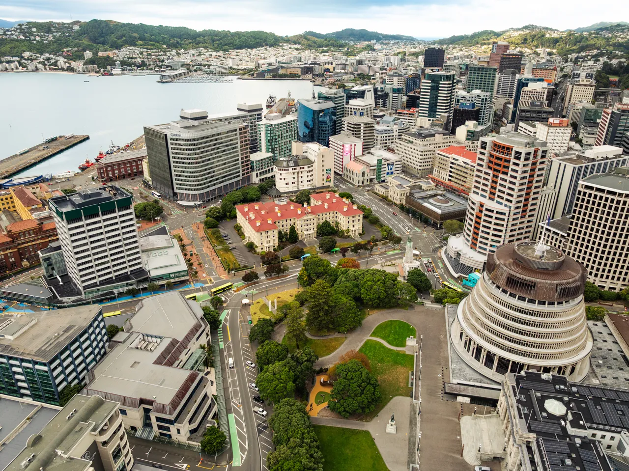 Aerial drone photograph of New Zealand Parliament and Victoria University Pipitea Campus at dawn, showing Rutherford House and Old Government Buildings